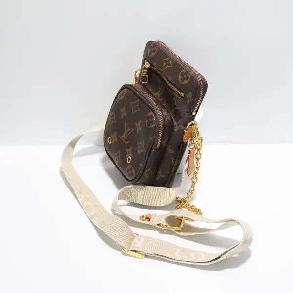 Louis Vuitton crossbody utility bag side
